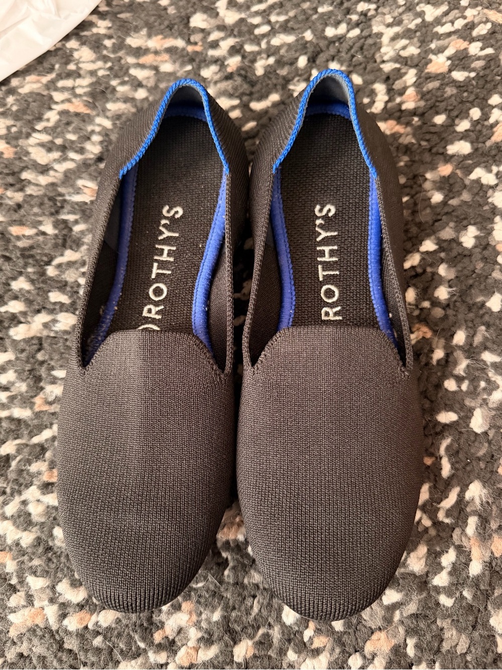 Rothy's Black Slip-On Flats with Blue Lining